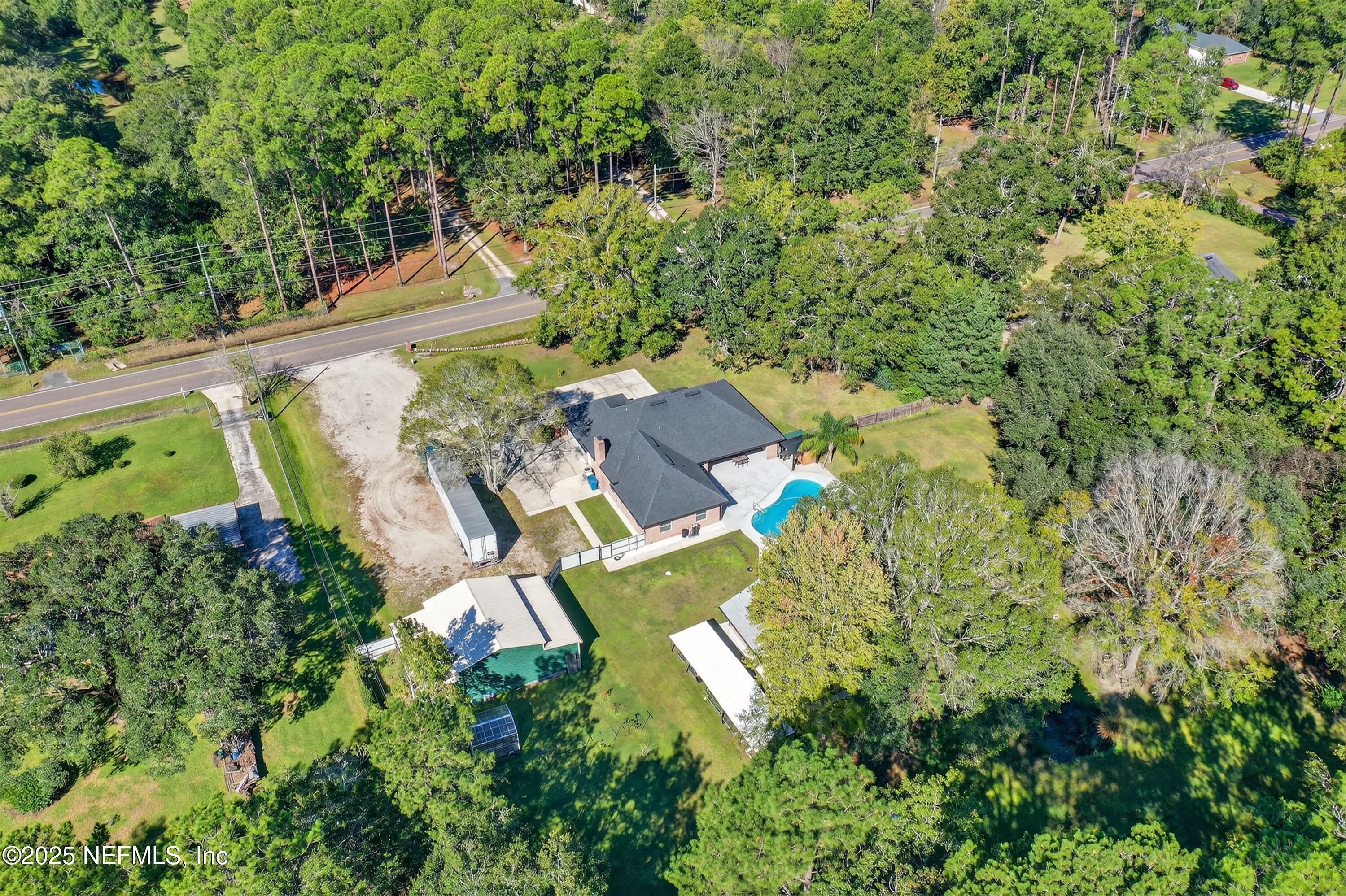 11341 V C Johnson Road Jacksonville, FL 32218 - Photo 39 of 70 an aerial view of a house with yard swimming pool and outdoor seating