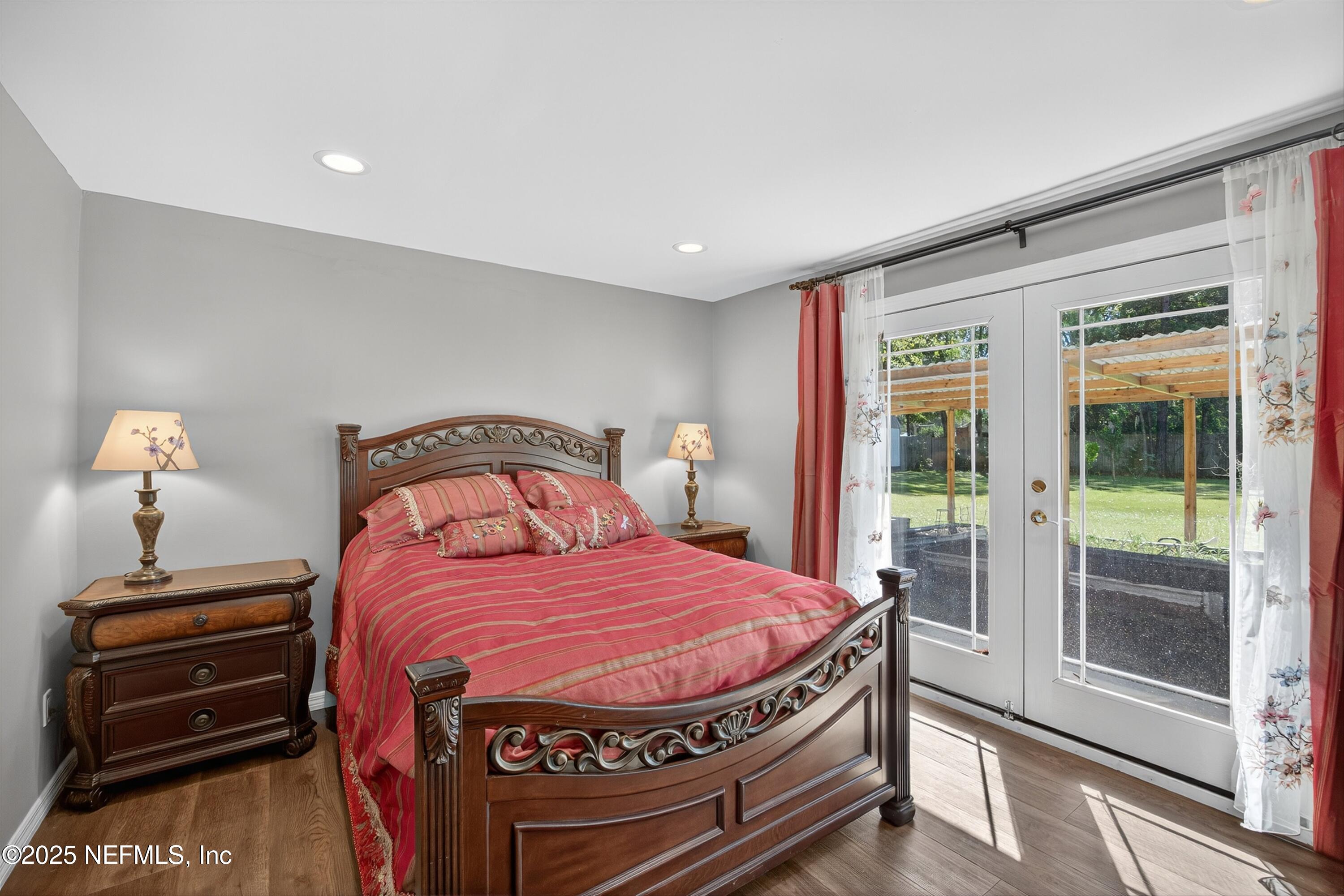 11341 V C Johnson Road Jacksonville, FL 32218 - Photo 50 of 70 a bedroom with a bed and a dresser next to a window