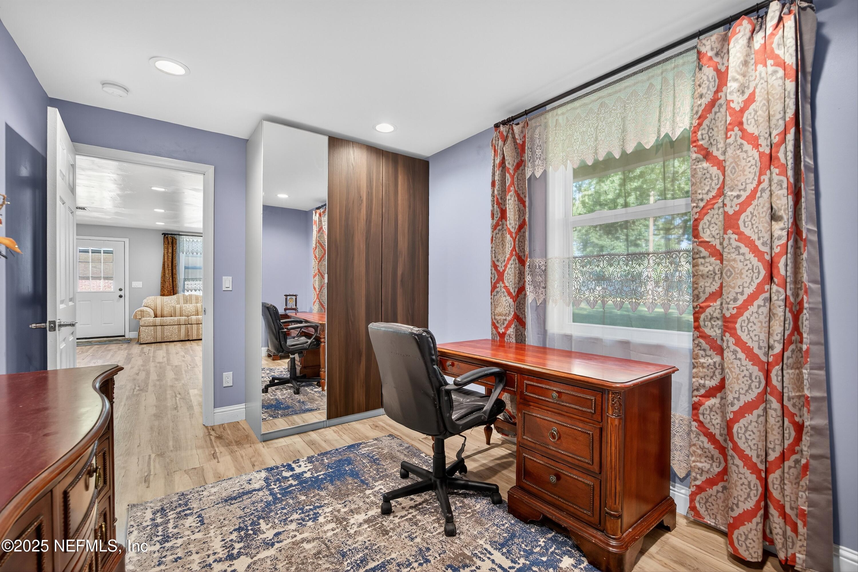 11341 V C Johnson Road Jacksonville, FL 32218 - Photo 55 of 70 a view of a workspace with furniture and a window