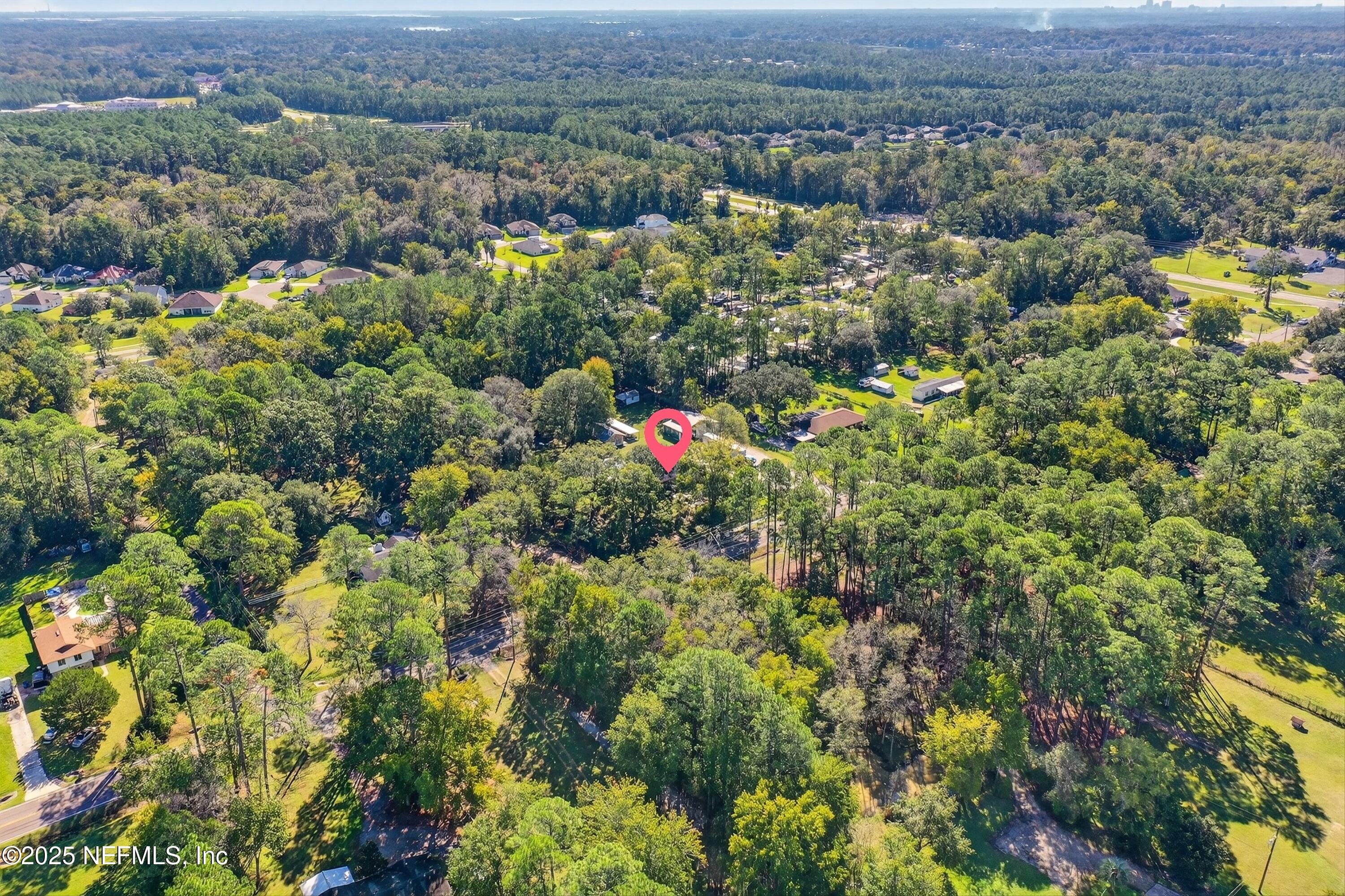 11341 V C Johnson Road Jacksonville, FL 32218 - Photo 67 of 70 an aerial view of residential house with outdoor space and trees all around