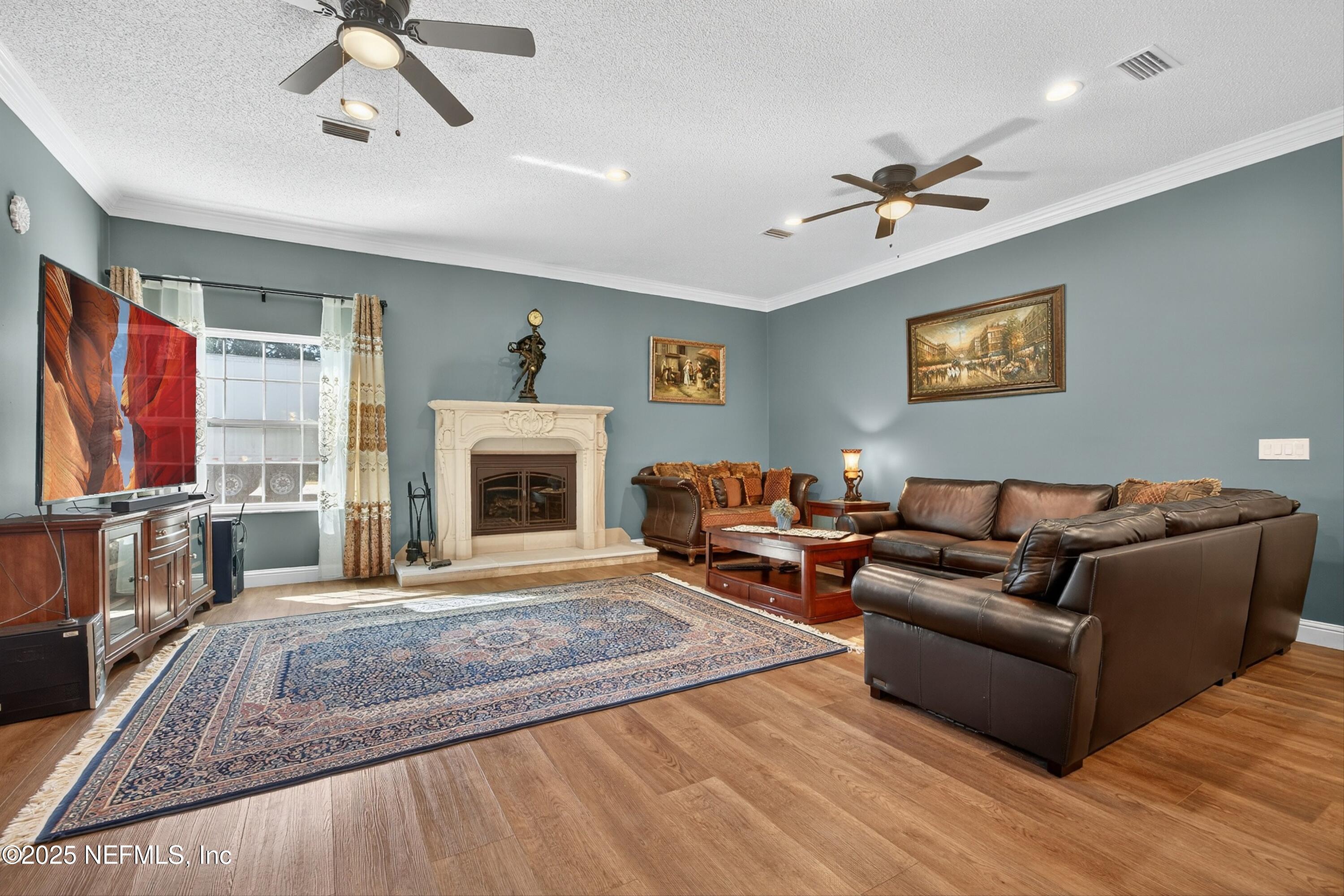 11341 V C Johnson Road Jacksonville, FL 32218 - Photo 7 of 70 a living room with furniture and a fireplace