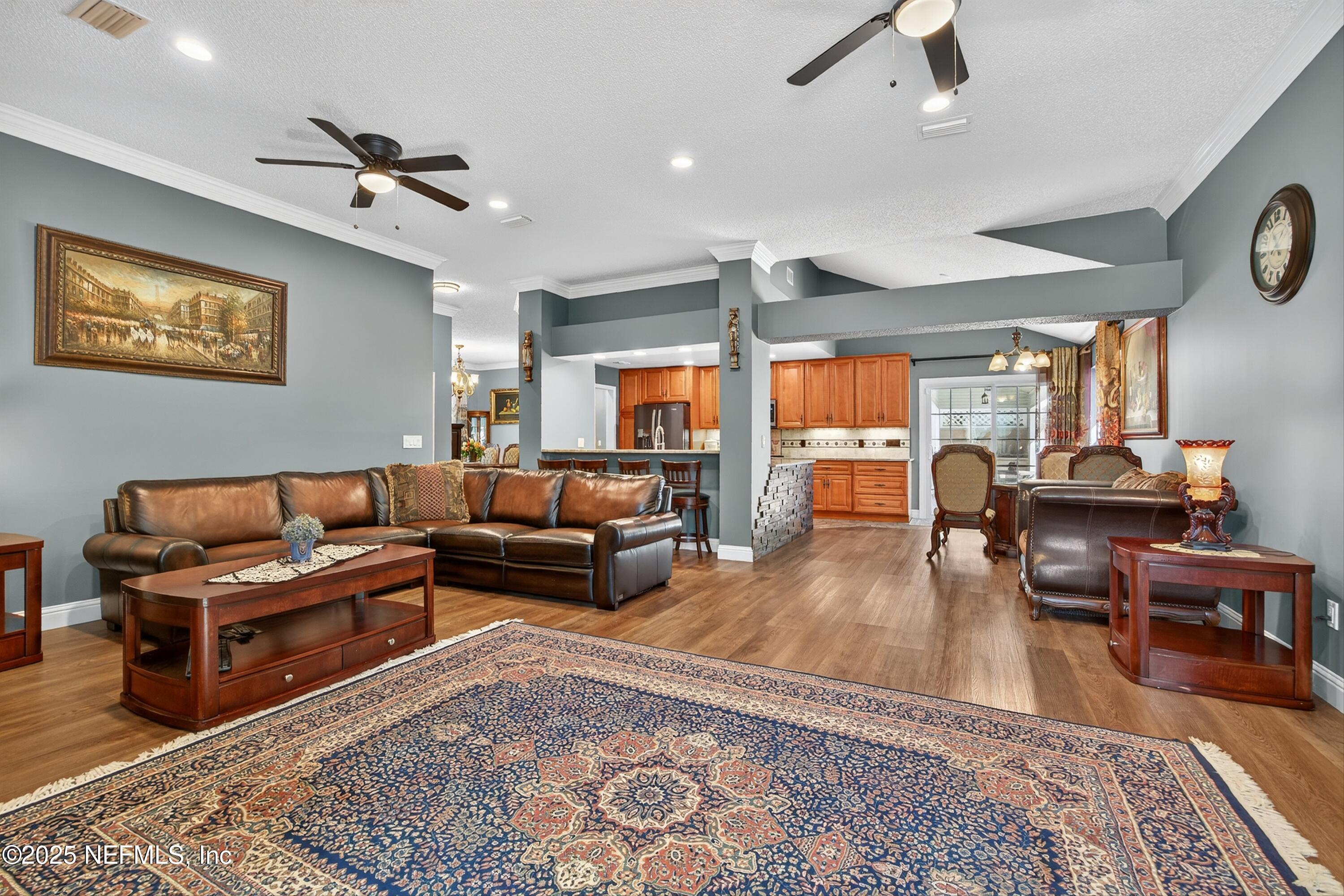 11341 V C Johnson Road Jacksonville, FL 32218 - Photo 9 of 70 a living room with furniture and a large window