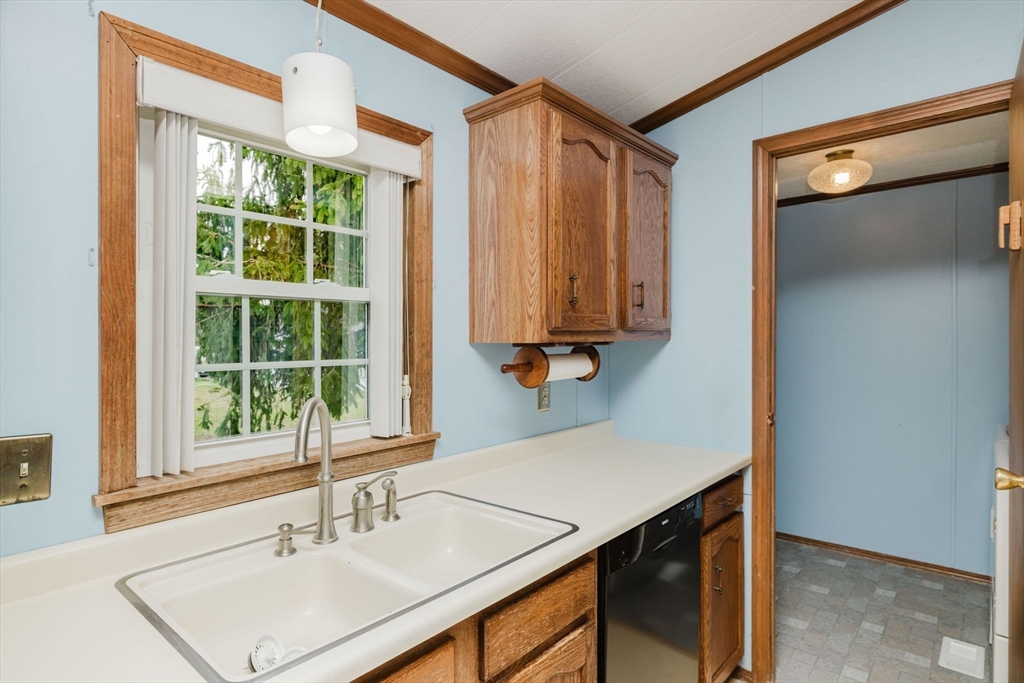 4 Tucker Terrace Raynham, MA 02767 - Photo 11 of 29 a bathroom with a sink and a mirror