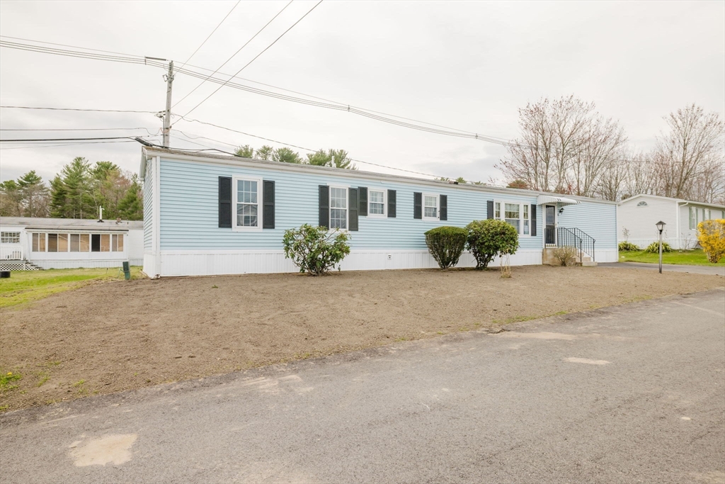 4 Tucker Terrace Raynham, MA 02767 - Photo 26 of 29 a front view of a house with a yard