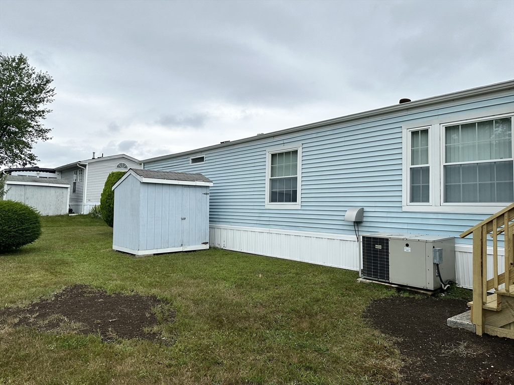 4 Tucker Terrace Raynham, MA 02767 - Photo 27 of 29 a view of a house with backyard and a tree