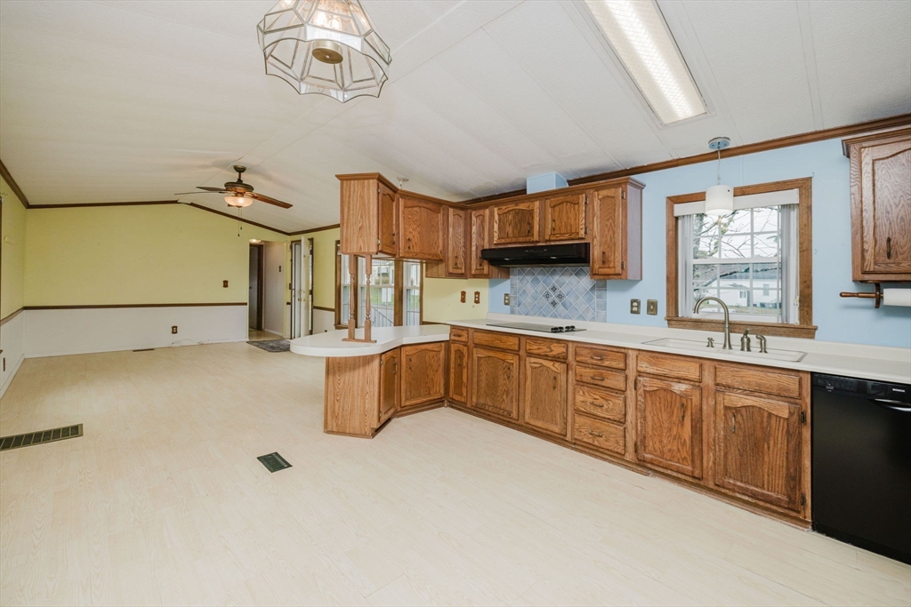 4 Tucker Terrace Raynham, MA 02767 - Photo 7 of 29 a kitchen with a sink appliances and cabinets