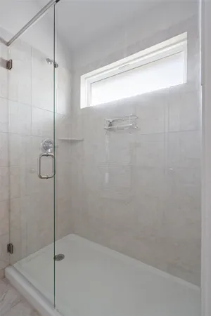 a bathroom with a sink vanity and mirror