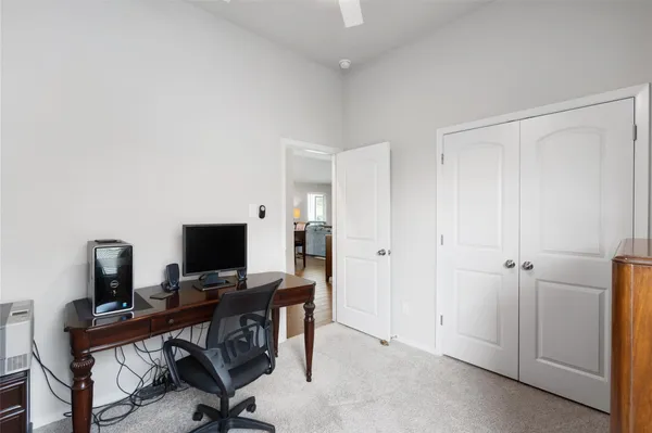 a room with gym equipment and a window