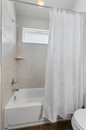 a bathroom with a sink mirror and vanity