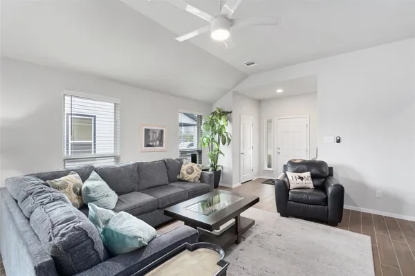 a living room with furniture and a window