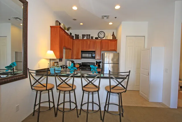 a view of a dining room with furniture and a window