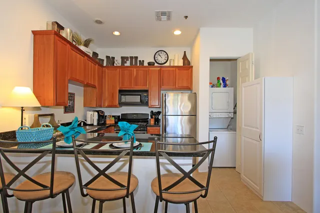 a view of a kitchen with furniture and a kitchen