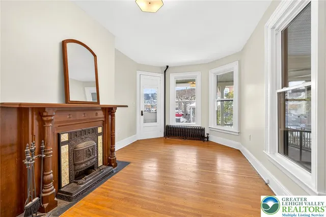 a kitchen with stainless steel appliances kitchen island granite countertop a refrigerator sink and white cabinets