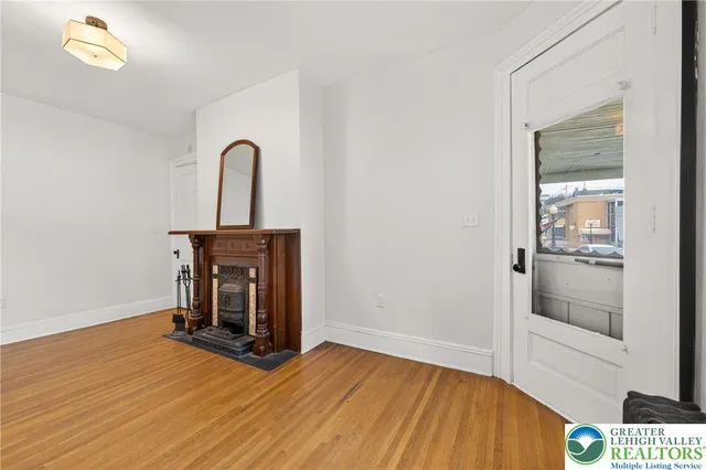 a view of a dining room with furniture wooden floor and chandelier