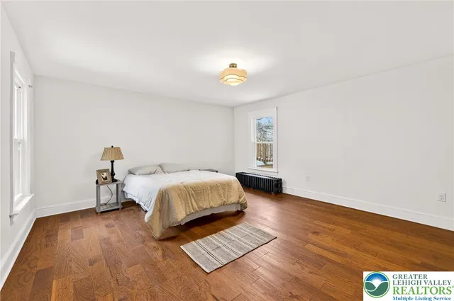 a view of a house with a yard and a patio