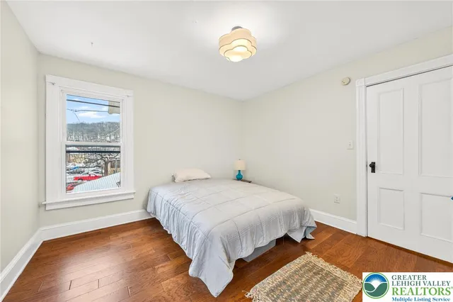 a view of a dining room with furniture and a chandelier