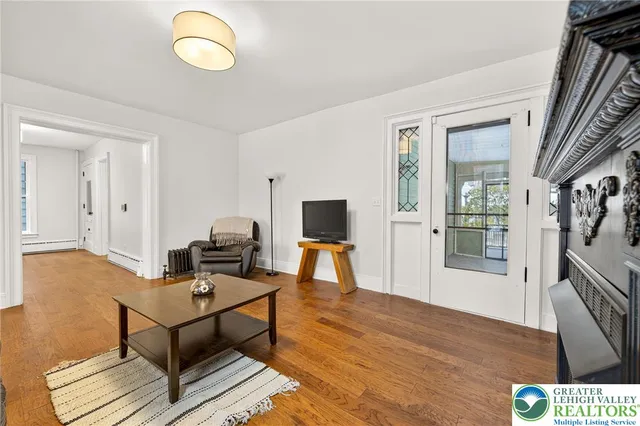 a view of a livingroom with furniture and a fireplace