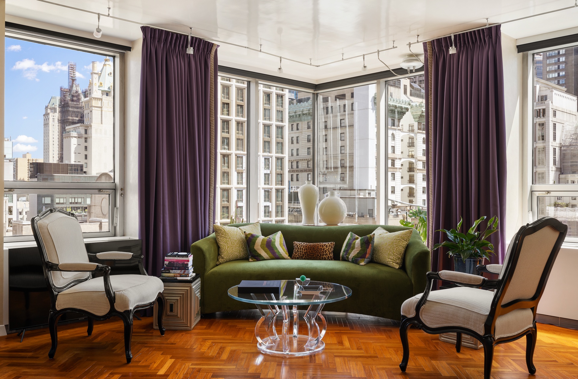 15 West 53rd Street, Unit 14G Manhattan, NY 10019 - Photo 1 of 10 a living room with furniture and a window