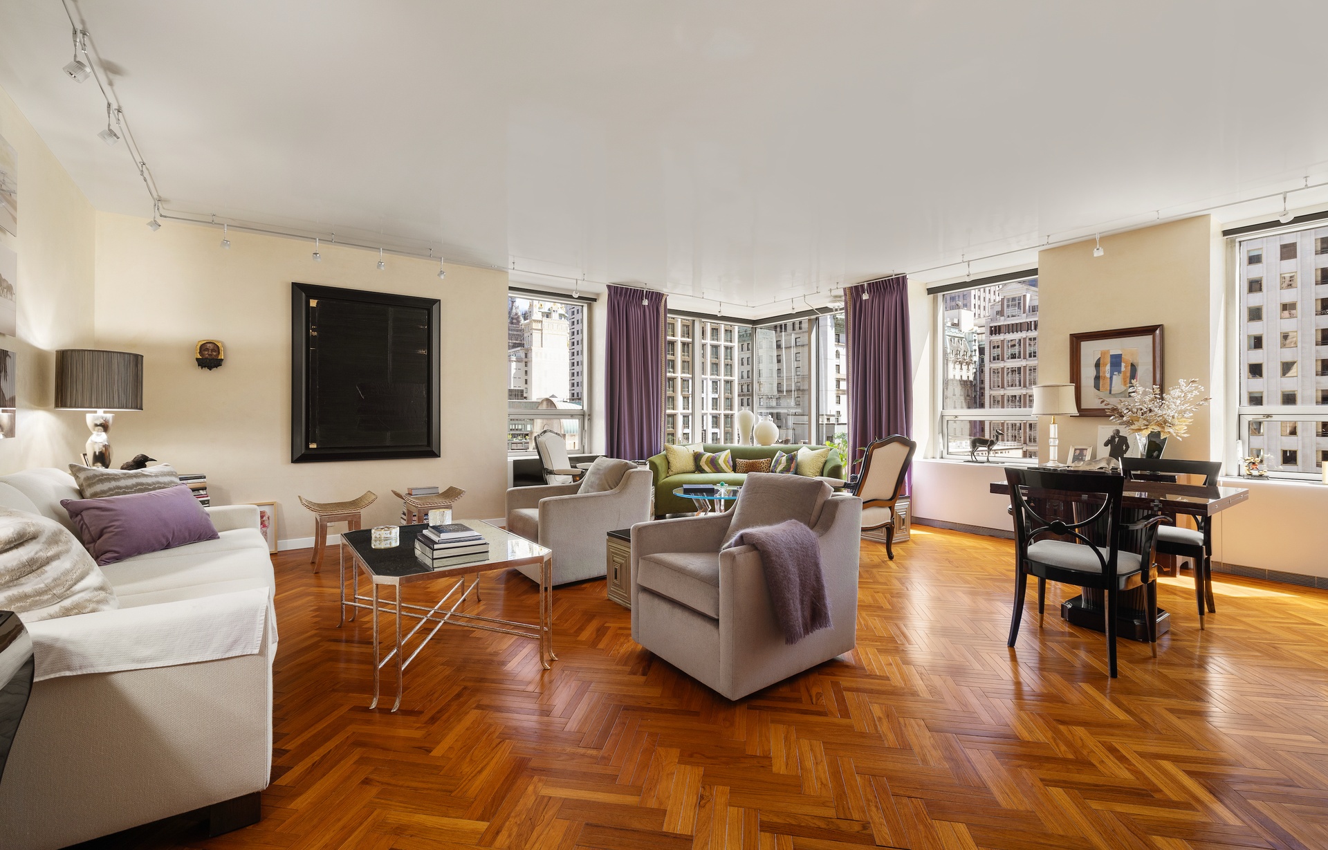 15 West 53rd Street, Unit 14G Manhattan, NY 10019 - Photo 2 of 10 a living room with furniture and a flat screen tv