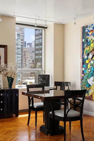 a view of a dining room with furniture and window