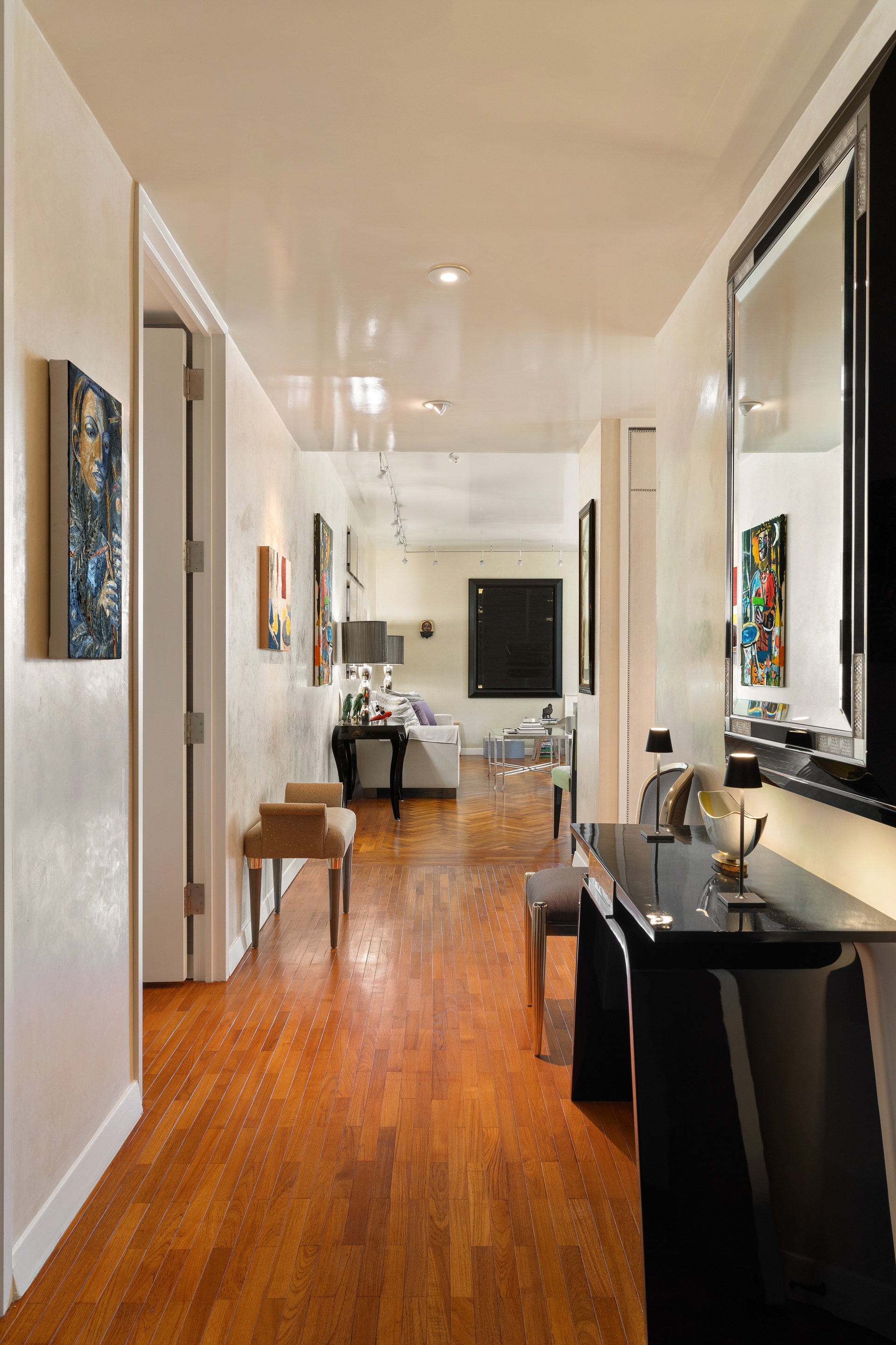 15 West 53rd Street, Unit 14G Manhattan, NY 10019 - Photo 7 of 10 a living room with furniture and a flat screen tv