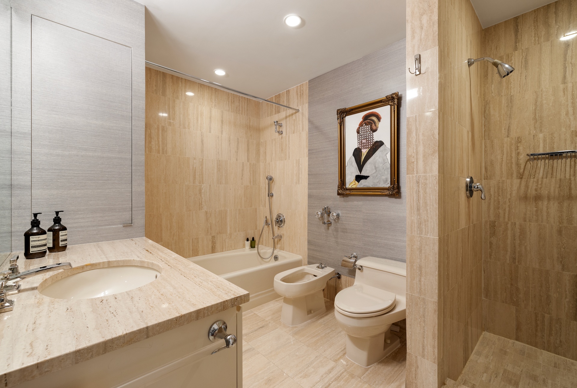 15 West 53rd Street, Unit 14G Manhattan, NY 10019 - Photo 9 of 10 a bathroom with a granite countertop sink toilet and shower