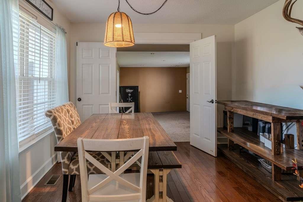 957 Bethlehem Road Rockmart, GA 30153 - Photo 16 of 33 a view of a dining room with furniture and wooden floor
