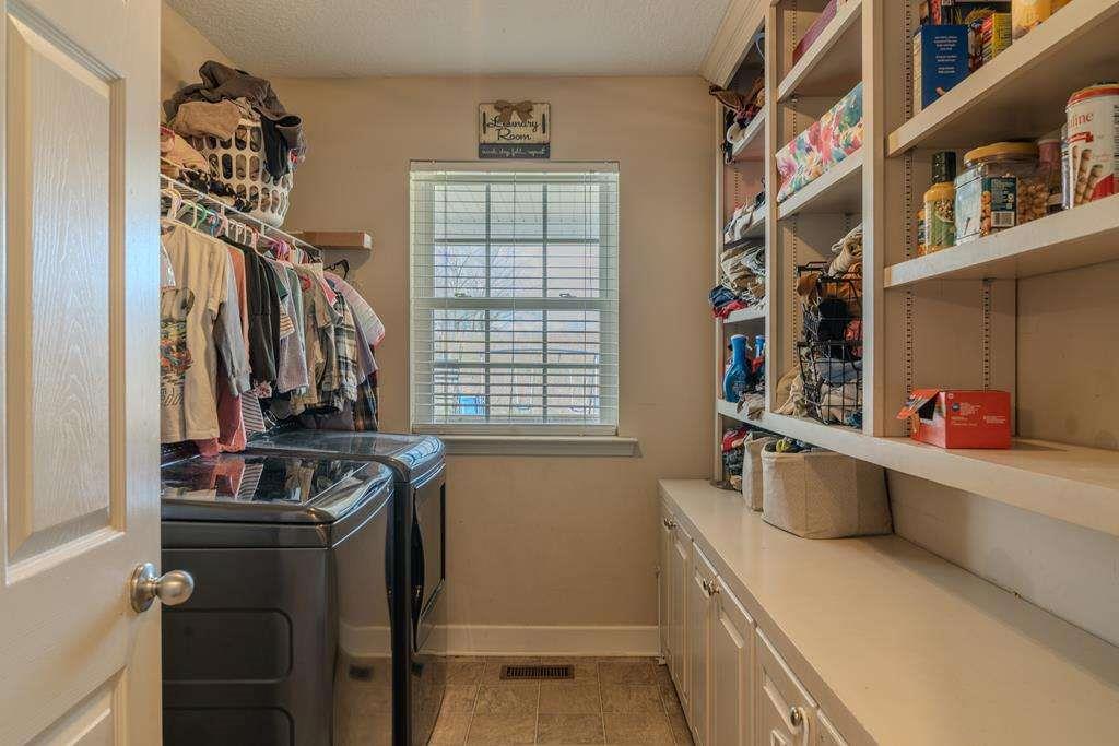 957 Bethlehem Road Rockmart, GA 30153 - Photo 17 of 33 a kitchen that has a sink and a stove