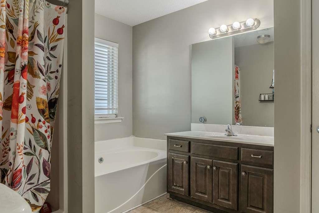 957 Bethlehem Road Rockmart, GA 30153 - Photo 20 of 33 a bathroom with a sink a mirror and a bathtub