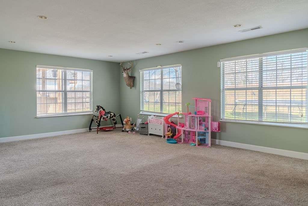 957 Bethlehem Road Rockmart, GA 30153 - Photo 24 of 33 a living room with furniture and a large window