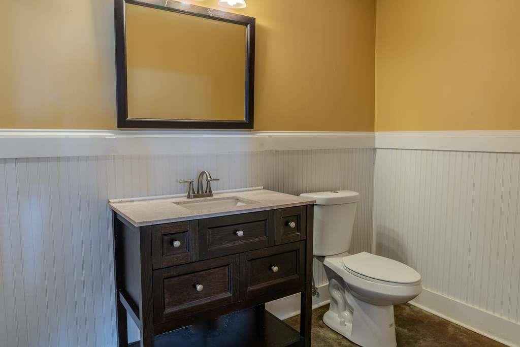 957 Bethlehem Road Rockmart, GA 30153 - Photo 27 of 33 a bathroom with a toilet a sink and mirror