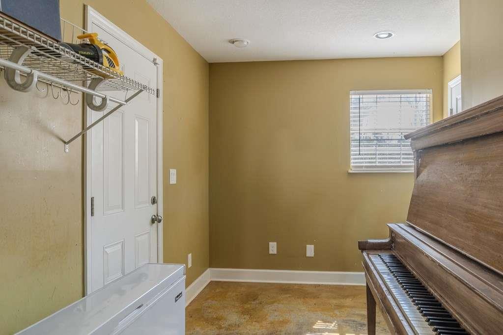 957 Bethlehem Road Rockmart, GA 30153 - Photo 28 of 33 a view of a room with a piano and wooden floor