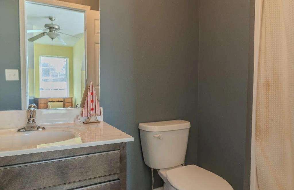 957 Bethlehem Road Rockmart, GA 30153 - Photo 33 of 33 a bathroom with a toilet sink and mirror