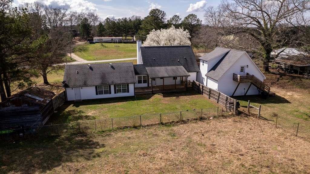 957 Bethlehem Road Rockmart, GA 30153 - Photo 7 of 33 an aerial view of a house with swimming pool and a yard
