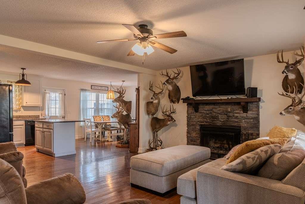 957 Bethlehem Road Rockmart, GA 30153 - Photo 10 of 33 a living room with furniture a flat screen tv and a fireplace