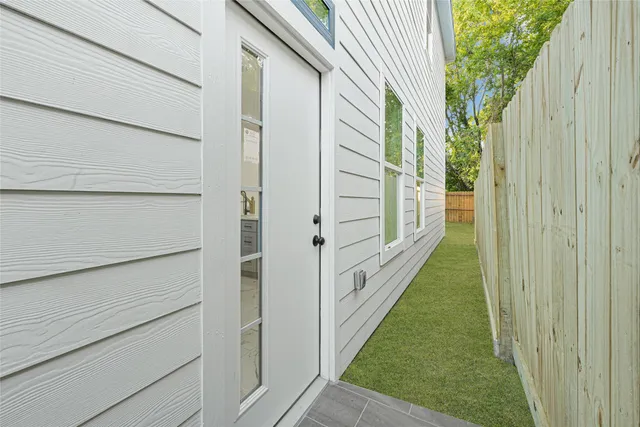a view of a pathway of a house with backyard