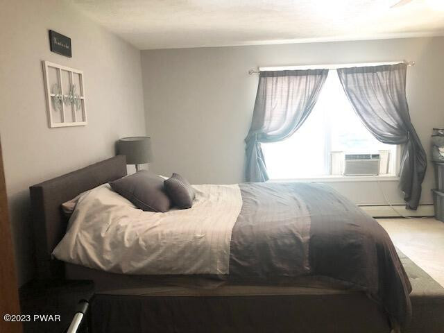 113 Beecher Road Dingmans Ferry, PA 18328 - Photo 12 of 24 a bedroom with a bed and a window