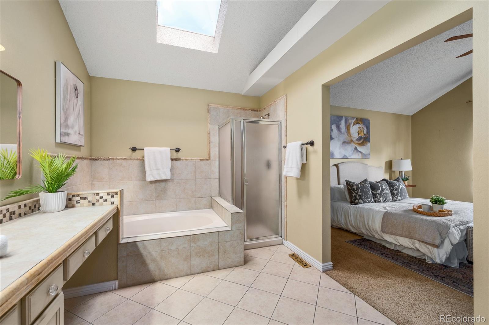 7412 Berkeley Court Castle Pines, CO 80108 - Photo 18 of 37 a bathroom with a tub sink and mirror