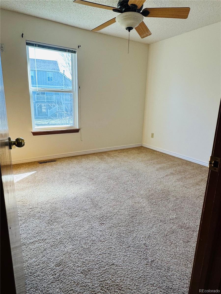 7412 Berkeley Court Castle Pines, CO 80108 - Photo 20 of 37 an empty room with a window