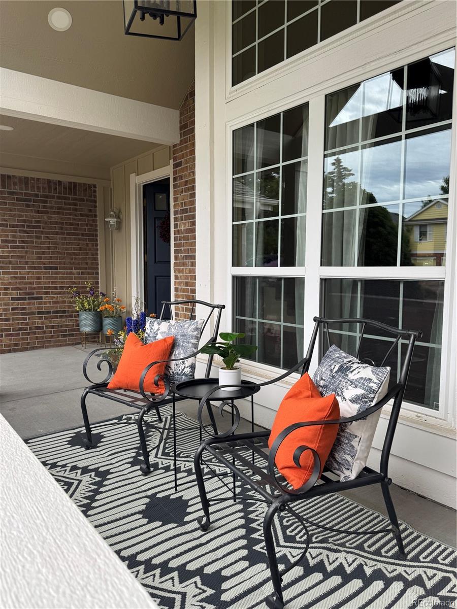 7412 Berkeley Court Castle Pines, CO 80108 - Photo 2 of 37 a view of a lounge chairs in the balcony