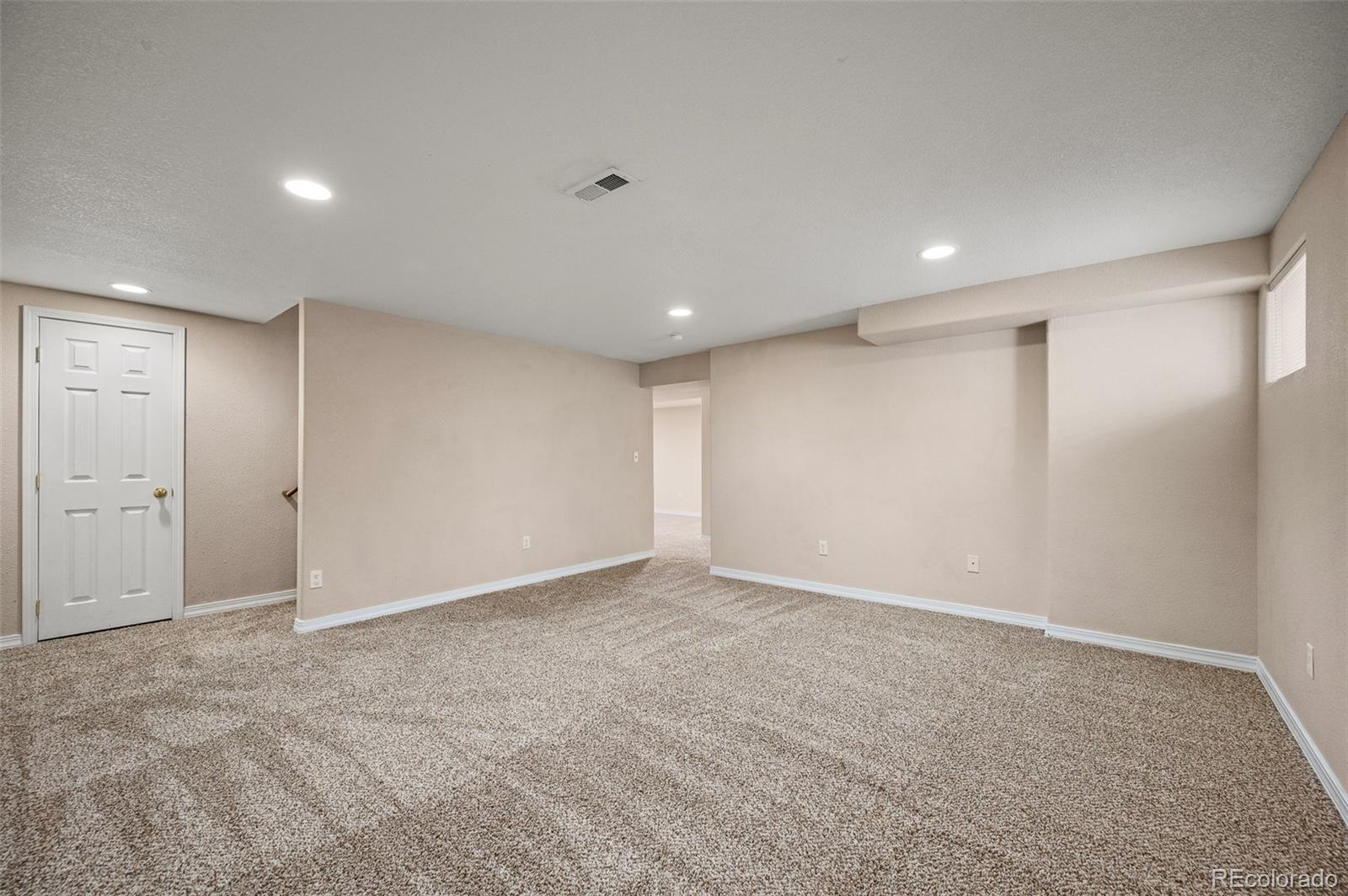7412 Berkeley Court Castle Pines, CO 80108 - Photo 24 of 37 a view of an empty room