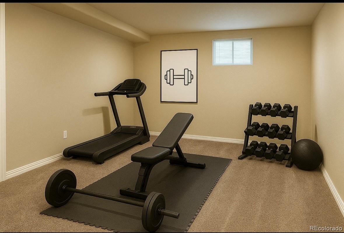 7412 Berkeley Court Castle Pines, CO 80108 - Photo 26 of 37 a room with gym equipment and a view of living room