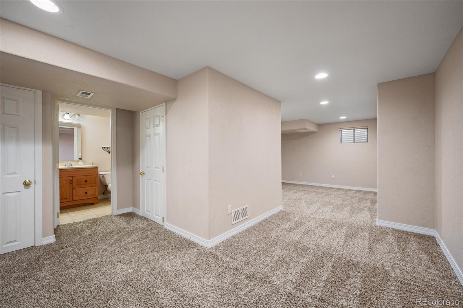 7412 Berkeley Court Castle Pines, CO 80108 - Photo 28 of 37 a view of an empty room and a bathroom