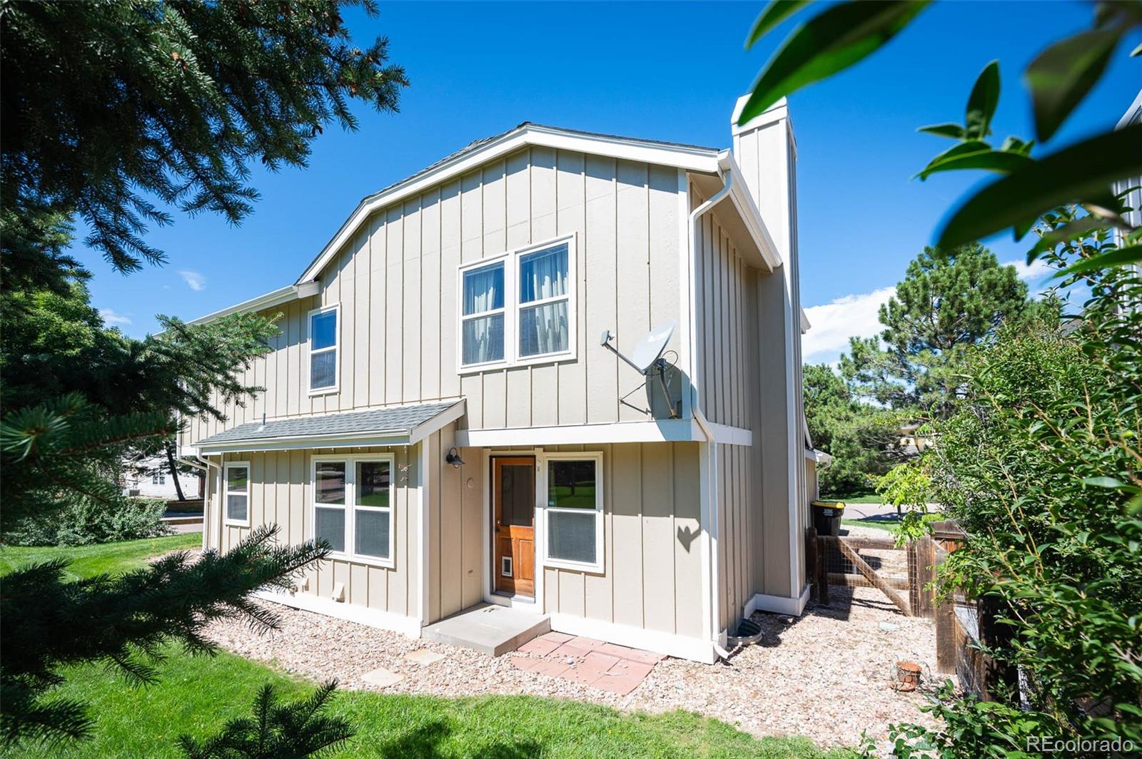 7412 Berkeley Court Castle Pines, CO 80108 - Photo 30 of 37 a front view of a house with a yard
