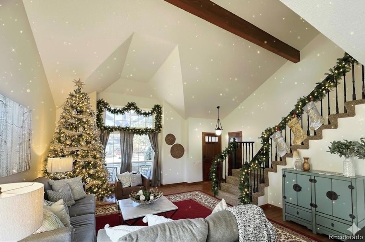 7412 Berkeley Court Castle Pines, CO 80108 - Photo 3 of 37 a living room with furniture and a large window
