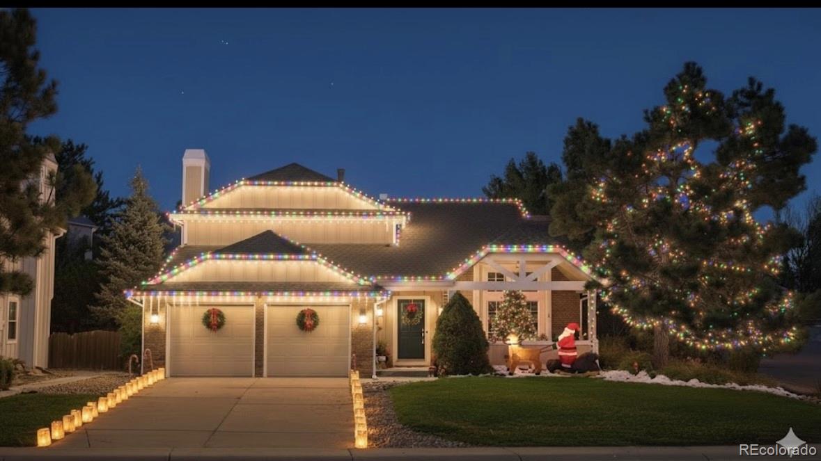7412 Berkeley Court Castle Pines, CO 80108 - Photo 37 of 37 a front view of a house with a yard