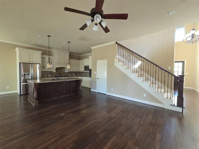 a view of kitchen with sink microwave and stove
