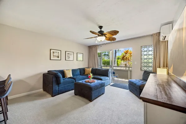 a living room with furniture and a large window
