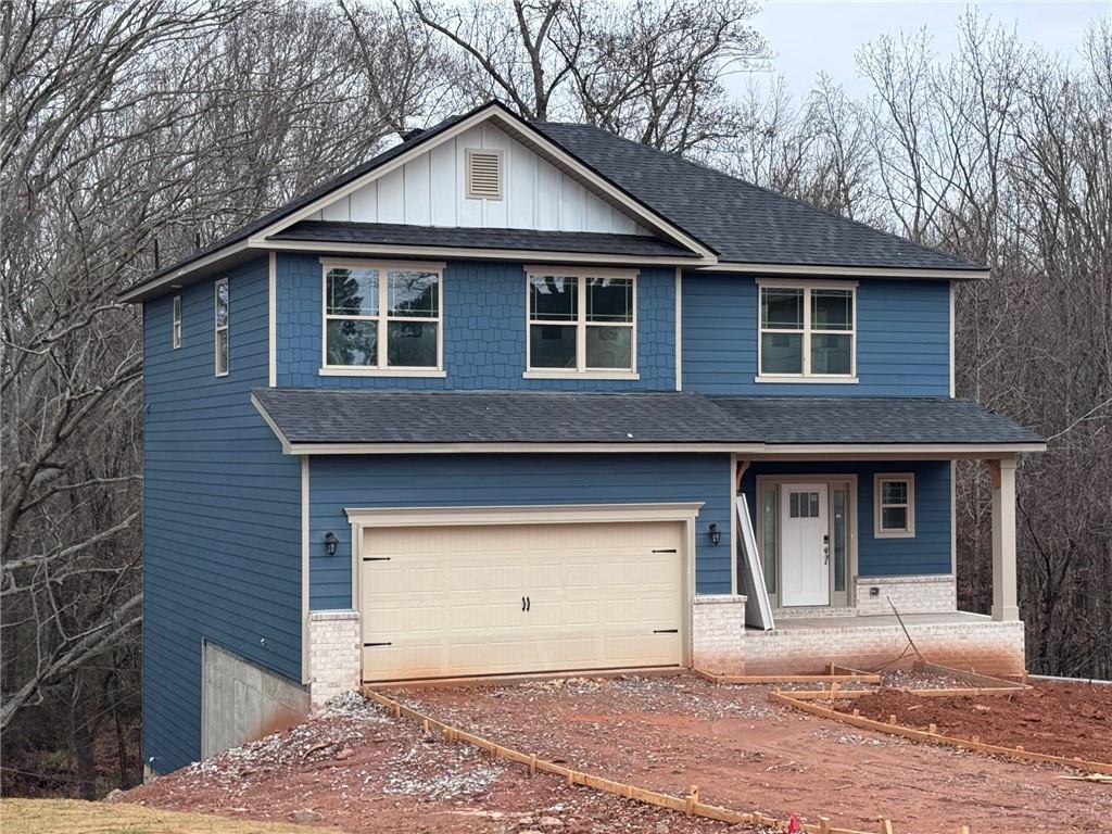 486 Magnolia Grove Place Cornelia, GA 30531 - Photo 2 of 36 a front view of a house with a yard