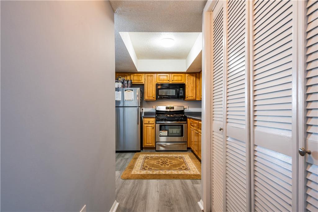 3301 Henderson Mill Road, Unit X4 Atlanta, GA 30341 - Photo 12 of 36 a kitchen with a refrigerator and a stove